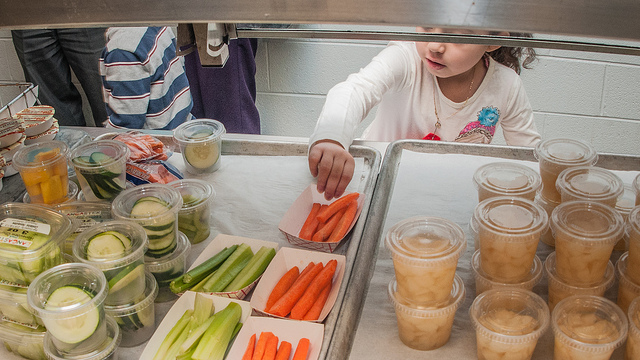 An elementary student in line for lunch. Photo credit: USDA.