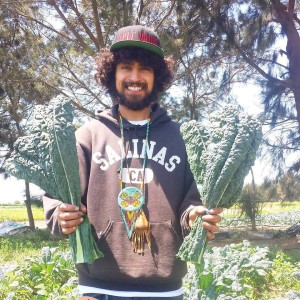 Rudy Jimenez showing off some California kale. Photo credit: ALBA.