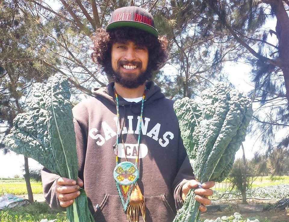Rudy Jimenez showing off some California kale. Photo credit: ALBA.