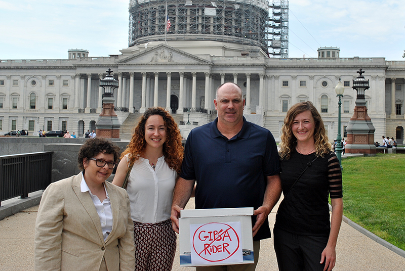 Poultry farmer Eric Hedrick delivering his anti-GIPSA rider petition to Congress with representatives from (left to right) GAP, RAFI, and NSAC