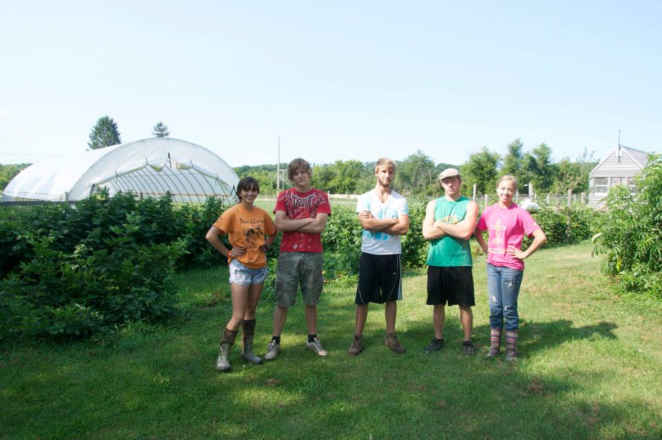 Wisconsin farmer Kriss Marion and her team outside their hoop house. Photo credit: Kriss Marion. 