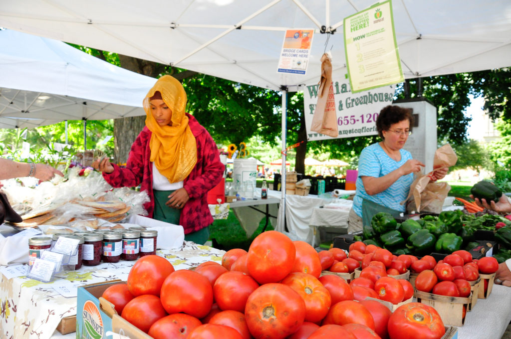Shoppers perusing produce at farmers market. Photo Credit: USDA